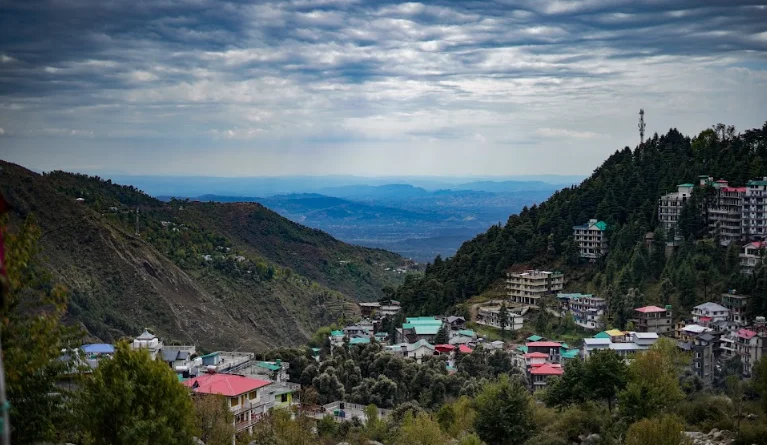 The image shows a landscape view of the mountains of Himachal Pradesh in the village of Dharamkot near Dharamshala India