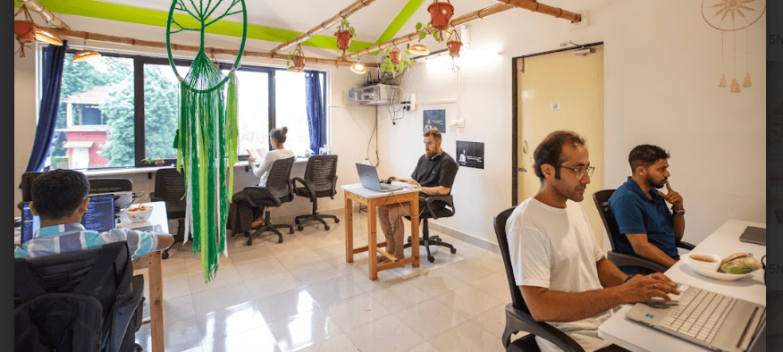 The image shows digital nomads in goa india coworking