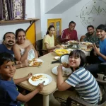 the image shows a community potluck for digital nomads in goa india at nomadgao assagao